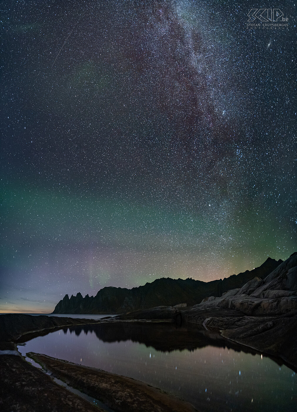 Senja - Tungeneset - Milky way The first northern lights appear very softly over the mountains on the rocky coast of Tungeneset around 11pm. The Milky Way is already breathtakingly beautiful and so I make a vertorama image. Stefan Cruysberghs